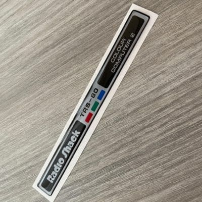 Radio Shack TRS-80 Colour Computer 2 silver sticker badge domed