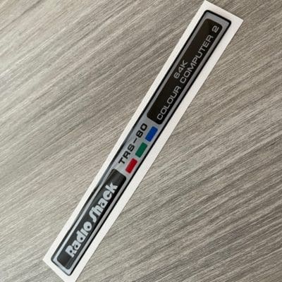 Radio Shack TRS-80 Color Computer 2 silver sticker badge domed